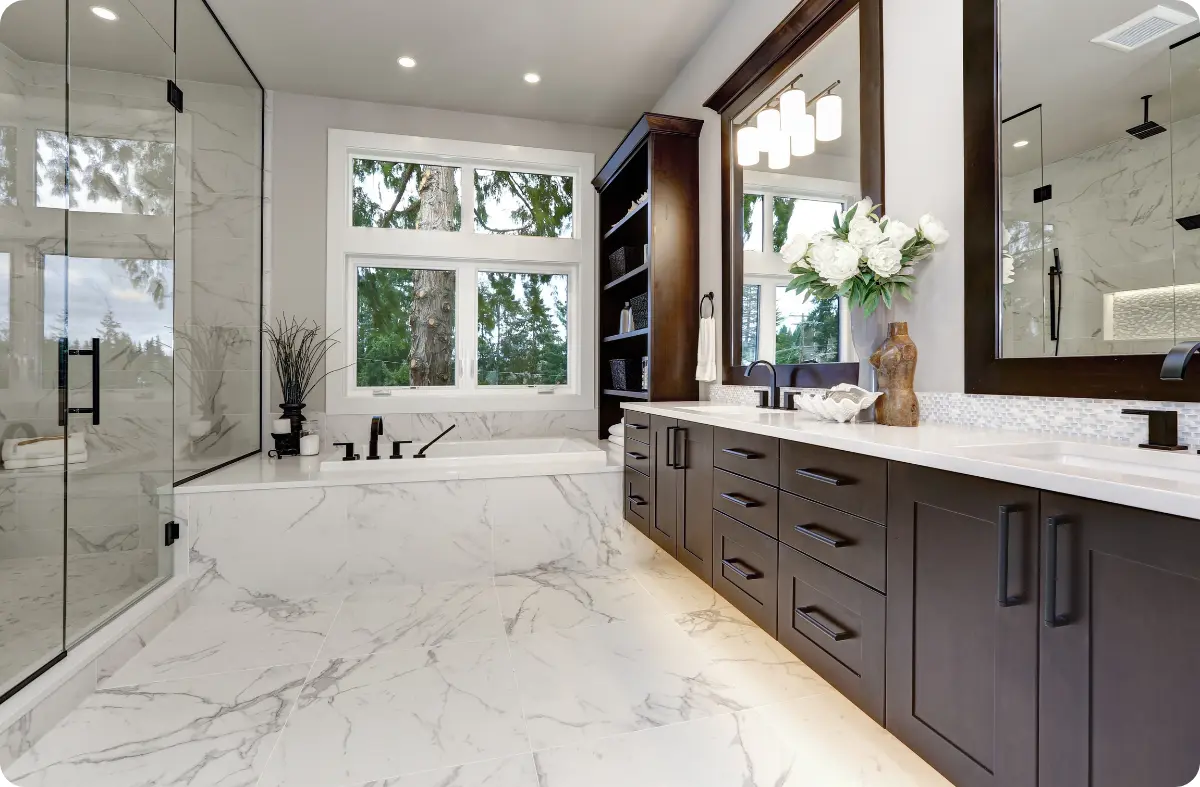 Luxury bathroom remodel with marble countertops and glass shower enclosure in Keller, TX
